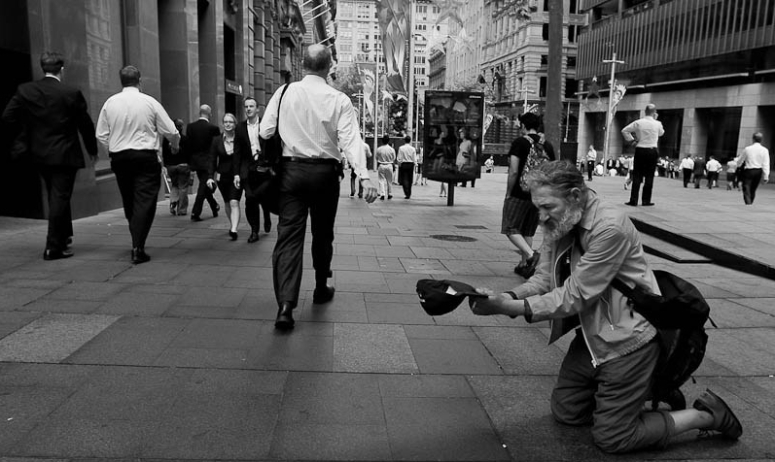 Man begging on his knees